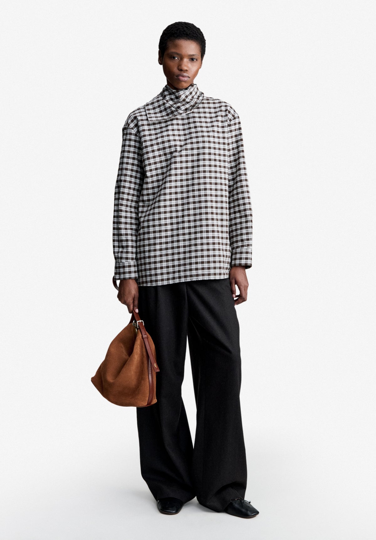 Loose-fit dark brown trousers with pleats - 1